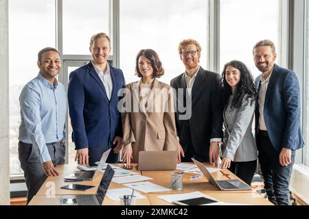 Diverse Business Team Posing for Photo in a Modern Office Stock Photo