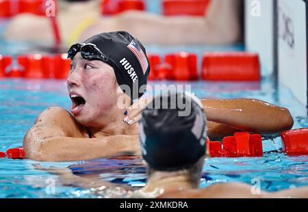 Paris, France. 28th July, 2024. Torri Huske (top) and Gretchen Walsh of the United States react during the women's 100m butterfly final of swimming at the Paris 2024 Olympic Games in Paris, France, July 28, 2024. Credit: Wang Peng/Xinhua/Alamy Live News Stock Photo