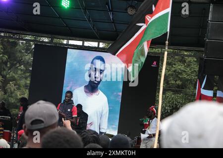Nakuru, Kenya. 28th July, 2024. An image of Austin Onyisa Makhoha, 17, who died at the hands of law enforcement during the tax hike and anti-government demonstrations held across the country in June and July, is displayed on a screen during a memorial concert. The police have been accused for the disappearances and the deaths of over 60 demonstrators who gathered in large numbers to protest against tax increases and poor governance. Credit: SOPA Images Limited/Ģ����ý Live News Stock Photo