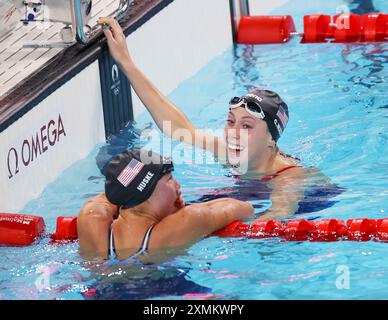 Paris, France. 28th July, 2024. Torri Huske (L) and Gretchen Walsh of the United States celebrate after the women's 100m butterfly final of swimming at the Paris 2024 Olympic Games in Paris, France, July 28, 2024. Credit: Luo Yuan/Xinhua/Alamy Live News Stock Photo