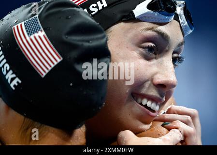 Paris, France. 28th July, 2024. Torri Huske (L) and Gretchen Walsh of the United States celebrate after the women's 100m butterfly final of swimming at the Paris 2024 Olympic Games in Paris, France, July 28, 2024. Credit: Wang Peng/Xinhua/Alamy Live News Stock Photo