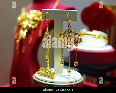 YICHANG, CHINA - JULY 28, 2024 - Gold jewelry displayed at a gold jewelry store in Yichang, Hubei province, China, July 28, 2024. In the first half of Stock Photo