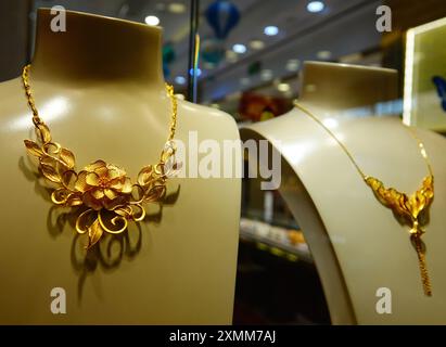 YICHANG, CHINA - JULY 28, 2024 - Gold jewelry displayed at a gold jewelry store in Yichang, Hubei province, China, July 28, 2024. In the first half of Stock Photo