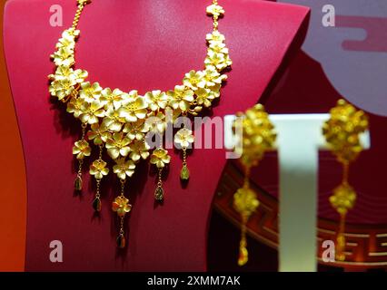 YICHANG, CHINA - JULY 28, 2024 - Gold jewelry displayed at a gold jewelry store in Yichang, Hubei province, China, July 28, 2024. In the first half of Stock Photo