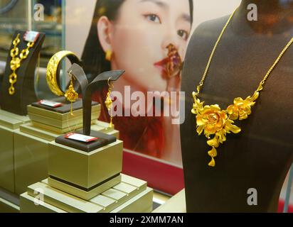 YICHANG, CHINA - JULY 28, 2024 - Gold jewelry displayed at a gold jewelry store in Yichang, Hubei province, China, July 28, 2024. In the first half of Stock Photo