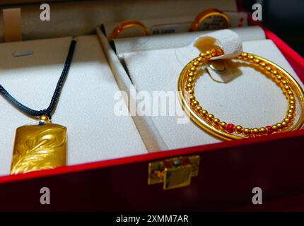 YICHANG, CHINA - JULY 28, 2024 - Gold jewelry displayed at a gold jewelry store in Yichang, Hubei province, China, July 28, 2024. In the first half of Stock Photo