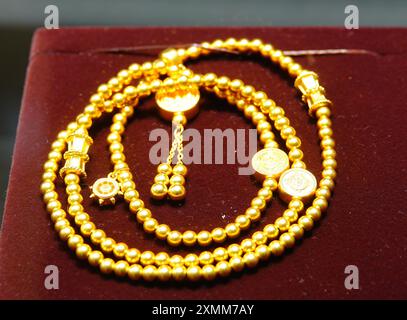 YICHANG, CHINA - JULY 28, 2024 - Gold jewelry displayed at a gold jewelry store in Yichang, Hubei province, China, July 28, 2024. In the first half of Stock Photo