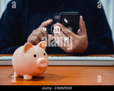 Online banking concept, saving account, financial transaction on mobile phone. Banking transaction data icons appear while person man using smartphone Stock Photo