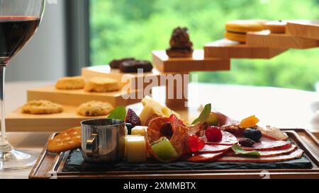 Beautifully arranged charcuterie board with meats, cheeses, and fruits Stock Photo
