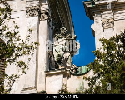 The statue of St. Dominic on the facade of the Church of Mary Magdalene (now the Organ Hall of the Lviv Conservatory) Stock Photo