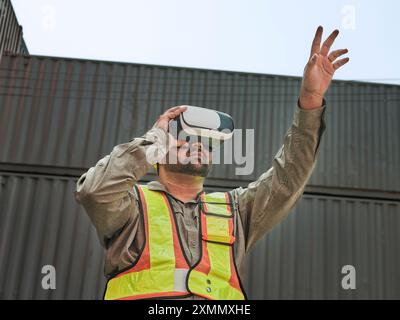 Engineer wearing an augmented reality headset and using gestures to control objects in augmented reality. Stock Photo