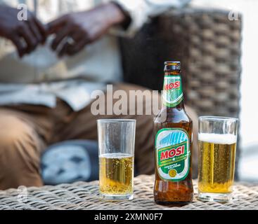 Local Zambian beer 'Mosi' and two beer glasses Stock Photo