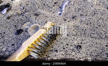 Detail of tool for scraping and cleaning dirt on metal Stock Photo