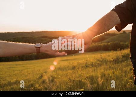 Romantic Sunset Hand in Hand Stock Photo