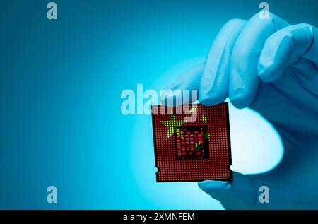 China's chip industry with electronic engineer holding computer chip. Electronic components in CPU and motherboard manufacturing sector. China role Stock Photo
