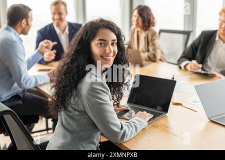 Businesswoman Working on Laptop in Modern Office Meeting Stock Photo