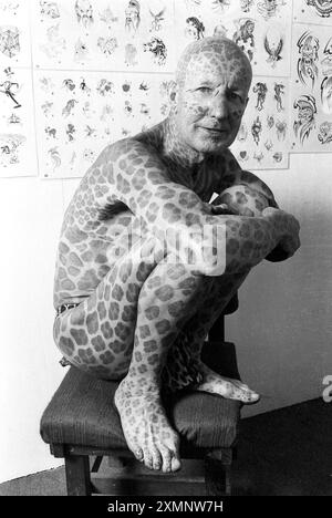 Tom Leppard, born as Tom Wooldridge, also known as Leopard Man or the Leopard Man of Skye, (14 October 1935 - 12 June 2016) .  He was considered  the most tattooed man and then the most tattooed senior citizen by the Guinness World Records. He spent £5,500 covering his body in leopard-like spots 26 October 1990 Picture by Roger Bamber Stock Photo