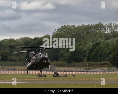 RAF Chinook Display Team demonstrating capabilities of their Boeing CH-47 Chinook at RIAT 2024 Stock Photo