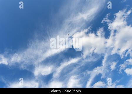 Abstract shapes formed by Cirrus clouds against a blue sky Stock Photo
