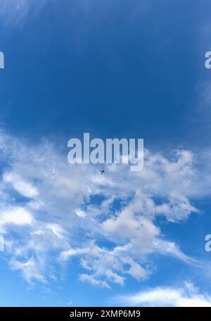 Abstract shapes formed by Cirrus clouds against a blue sky Stock Photo