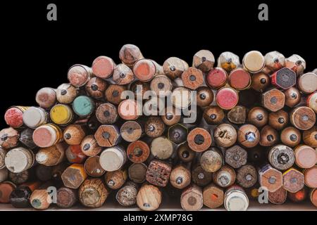 Used worn wooden pencils with eraser with black background Stock Photo