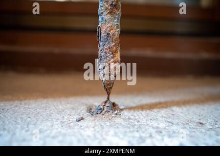 Venice, Italy - June 04, 2024: Grille on the window that is almost destroyed by corrosion. Macro shot. Stock Photo