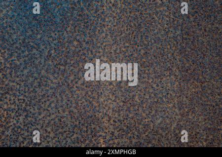 Rusty sheet metal with a porous structure, rust texture. Abstract background. Trencin, Slovakia Stock Photo