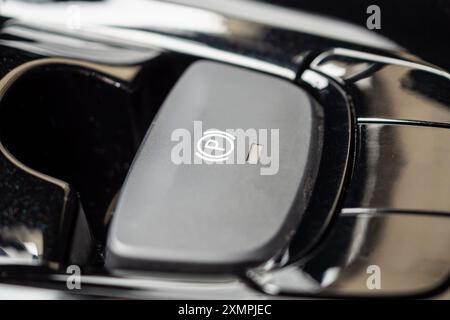 electronic handbrake button in luxury modern car Stock Photo