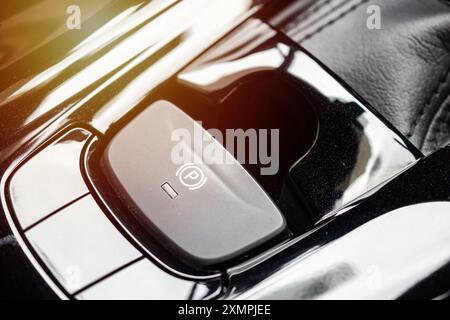 electronic handbrake button in luxury modern car Stock Photo
