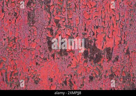 Cracked paint on the sheet metal with rust, texture. Damaged weathered peeling coating. Abstract pattern, background. Trencin, Slovakia Stock Photo