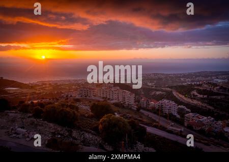 The scenic sunset over Mediterranean sea in Beirut, Lebanon capital, in the Lebanese mountains during the cloudy day. Stock Photo