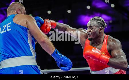 Paris, France. 29th July, 2024. Nelvie Raman Tiafack (R) of Germany competes with Mahammad Abdullayev of Azerbaijan during the men's 92kg preliminaries round of 16 of boxing at the Paris 2024 Olympic Games in the North Paris Arena in Paris, France, on July 29, 2024. Credit: Jiang Wenyao/Xinhua/Alamy Live News Stock Photo