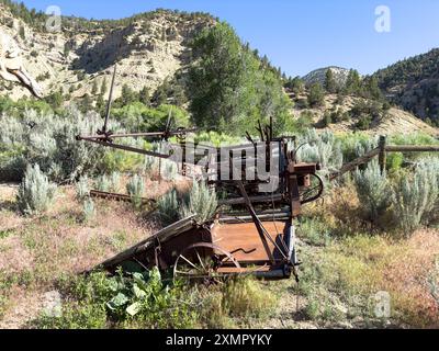 An antique grain binder or reaper-binder at the Nine Mile Ranch in Nine Mile Canyon in Utah. Stock Photo