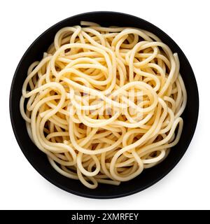 Cooked spaghetti in a black ceramic bowl isolated on white. Top view. Stock Photo