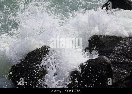 Waves hitting rocks Stock Photo