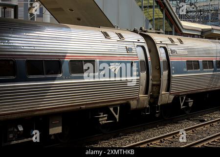 Stamford, CT - June 23, 2024: Amtrak train detail on railroad tracks in Stamford, Connecticut. Stock Photo