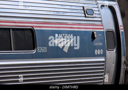 Stamford, CT - June 23, 2024: Amtrak train detail on railroad tracks in Stamford, Connecticut. Stock Photo