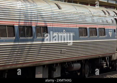 Stamford, CT - June 23, 2024: Amtrak train detail on railroad tracks in Stamford, Connecticut. Stock Photo