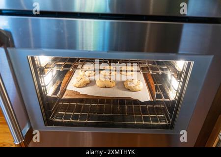 Homemade Chocolate chips cookies baking in the oven Stock Photo
