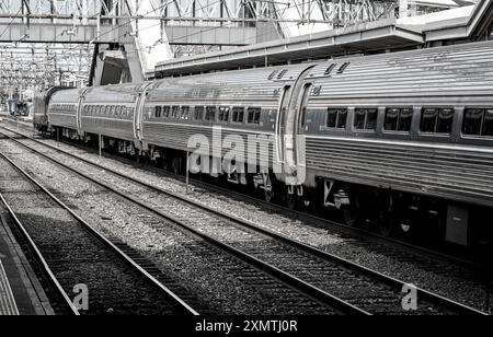 Stamford, CT - June 23, 2024: Amtrak train detail on railroad tracks in Stamford, Connecticut. Stock Photo