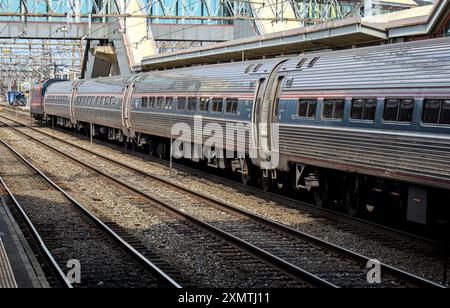 Stamford, CT - June 23, 2024: Amtrak train detail on railroad tracks in Stamford, Connecticut. Stock Photo