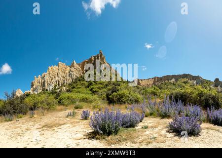 Omarama Clay Cliffs : unique and dramatic landscape with towering steep pinnacles, deep ravines, and sharp ridges formed by natural erosion, Waitaki V Stock Photo