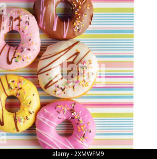 Colorful donuts on a striped napkin Stock Photo