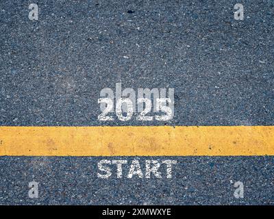 New year 2025 concept. Text 2025 written on the road in the middle of asphalt road. Concept of planning, goal, Challenge, Getting ready for the new ye Stock Photo