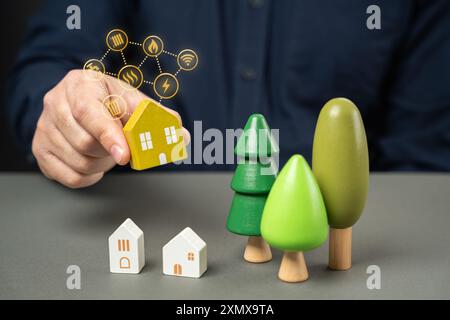 A man studies the qualities of a house, its eco-friendliness and autonomy. Snowmaking technologies cost effective, low carbon footprint. Buying a hous Stock Photo