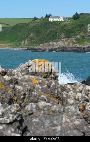 Coastal property on beautiful coastline at Killantringan Bay near Portpatrick on the Galloway coastline Wigtownshire Scotland in July 2024 Stock Photo