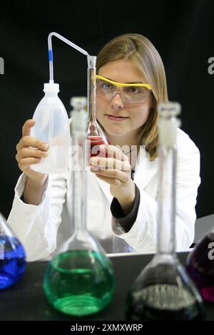 A researcher of chemistry doing a science experiment in the lab. Stock Photo