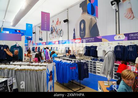 Paris 2024 official store located in a temporary structure on the Champs-Elysées, selling branded merchandise products Stock Photo