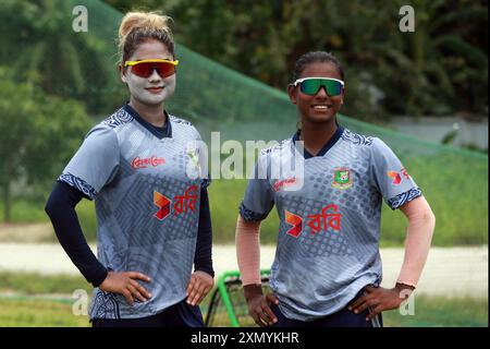 Bangladesh fast bowler Jahanara Alam (L) and Marufa Akhter (R) during Bangladesh Women’s cricket team attends practice at Bangladesh Krira Shikkha Pro Stock Photo