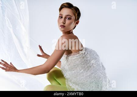 A woman in green tights wears a dress made of bubble wrap Stock Photo - Alamy A woman in green tights wears a dress made of bubble wrap Stock Photo - Alamy